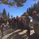 Teens lined up learning about forestry projects