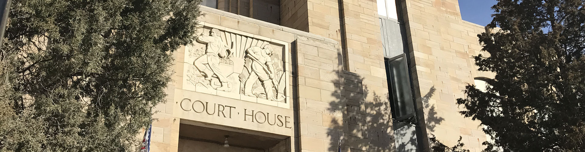 Courthouse art deco relief showing miner and farmer