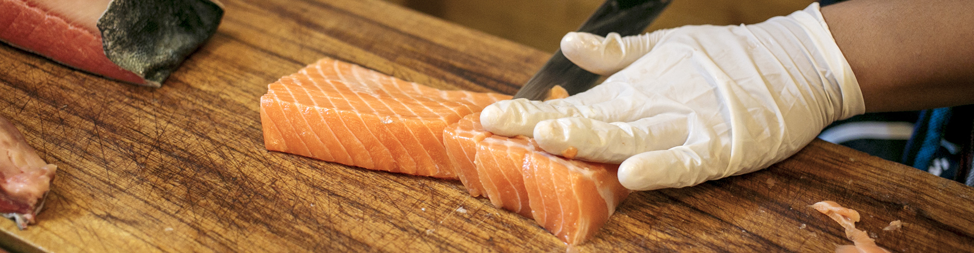 chef cutting salmon