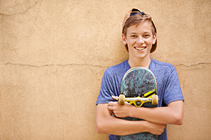 teen boy with a skateboard
