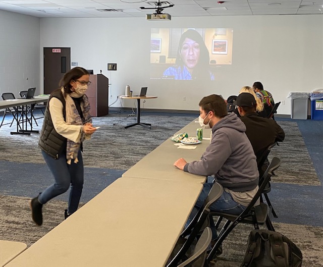 Meeting in a room. People seating on large table