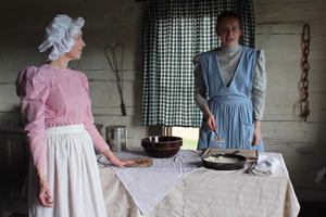 Volunteers making bread at the historic Walker Ranch house