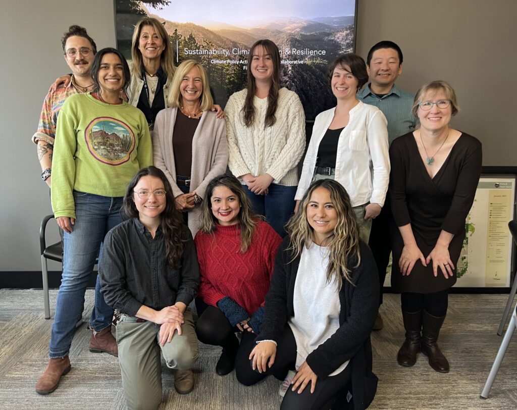 Group photo of 11 participants and OSCAR staff in the Climate Policy Action Leadership Collaborative, standing in two rows indoors