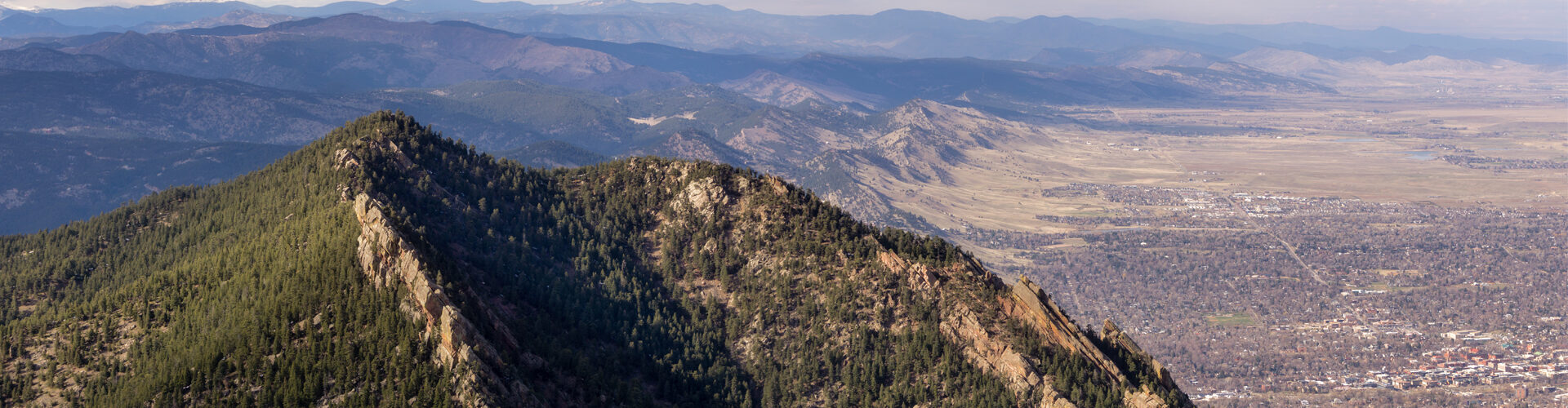 Photo overlooking mountains and plains of Boulder County