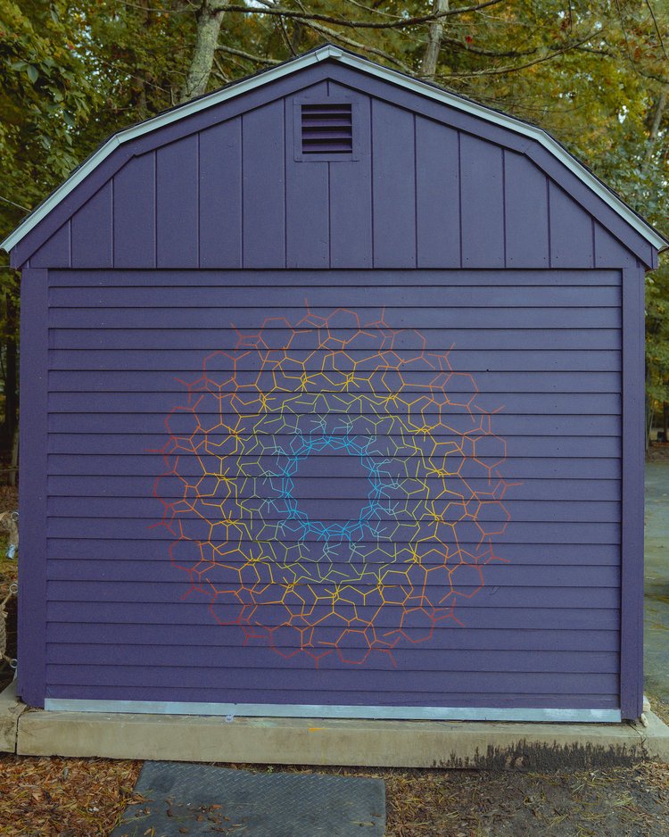 colorful artwork on a purple garage door