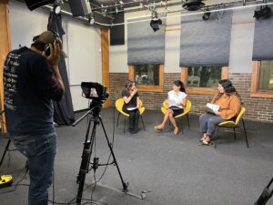 Pictured left to right above: Rossana Longo Better, Colorado News Collaborative. Boulder County Commissioner Marta Loachamin and Tanya Jimenez, Housing Developer with the Boulder County Housing Authority in a TV interview 