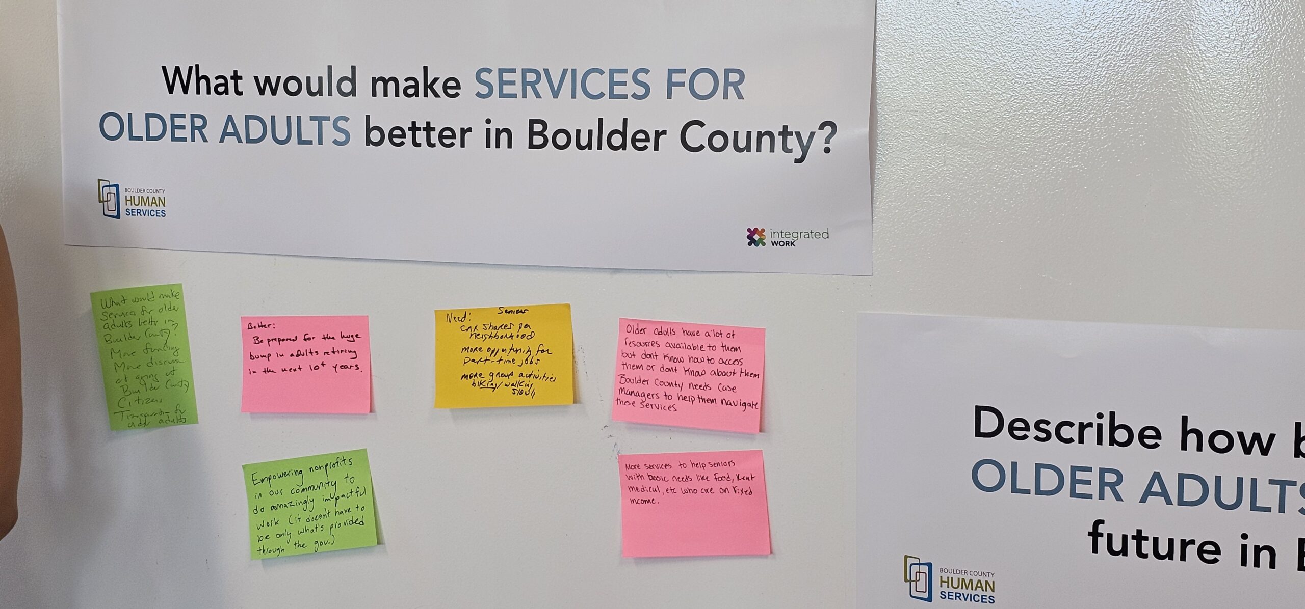 Image of sticky notes on a white board, answering the question what would make services for older adults better in Boulder County?