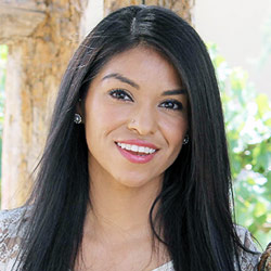 A headshot of a smiling Claudia Gordilla Villa