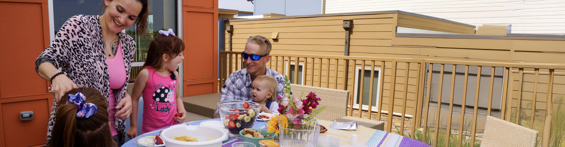 Family enjoying lunch together on an outdoor patio