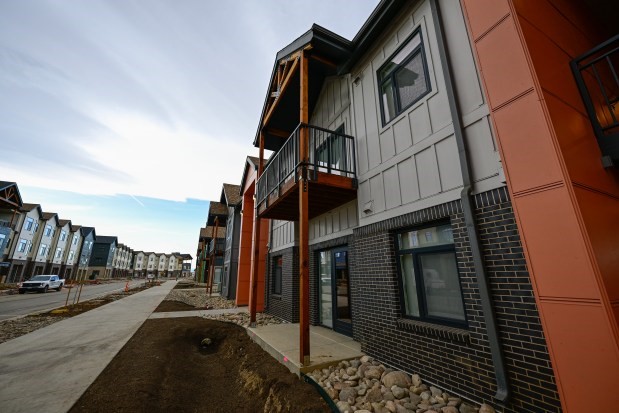 A view of a row of two-story townhomes that are part of Willoughby Corner affordable housing in Lafayette Colorado.