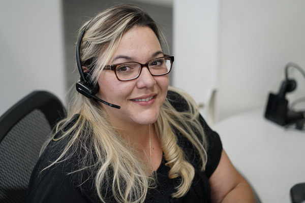 Woman smiling with headphones on