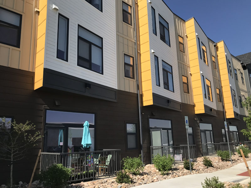 Modern Willoughby Corner building with multiple stories and large windows.