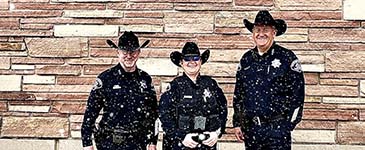 Sheriff and staff members in the snow