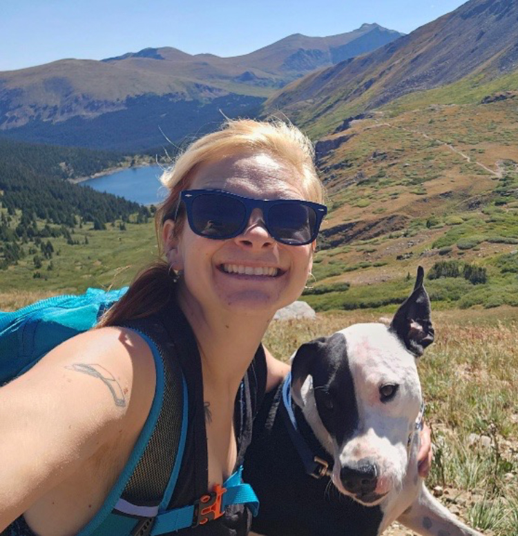 Photo of Jordan Buggert on a hike with her dog