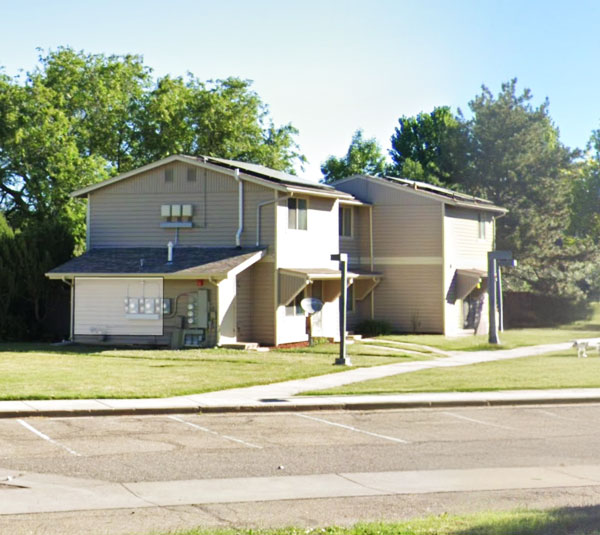 Exterior view town homes at Catamaran Court in Gunbarrel. They are two-stories and beige.