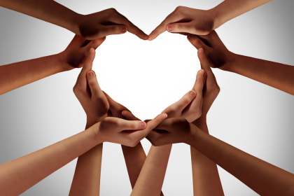 A heart shape made up of a bunch of different hands.