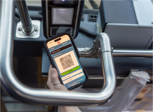 Person scanning their RTD MyRide QRCode on a bus