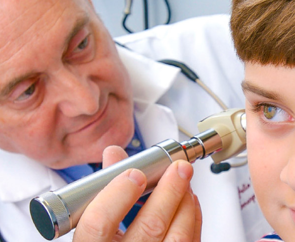 doctor looking in a childs ear