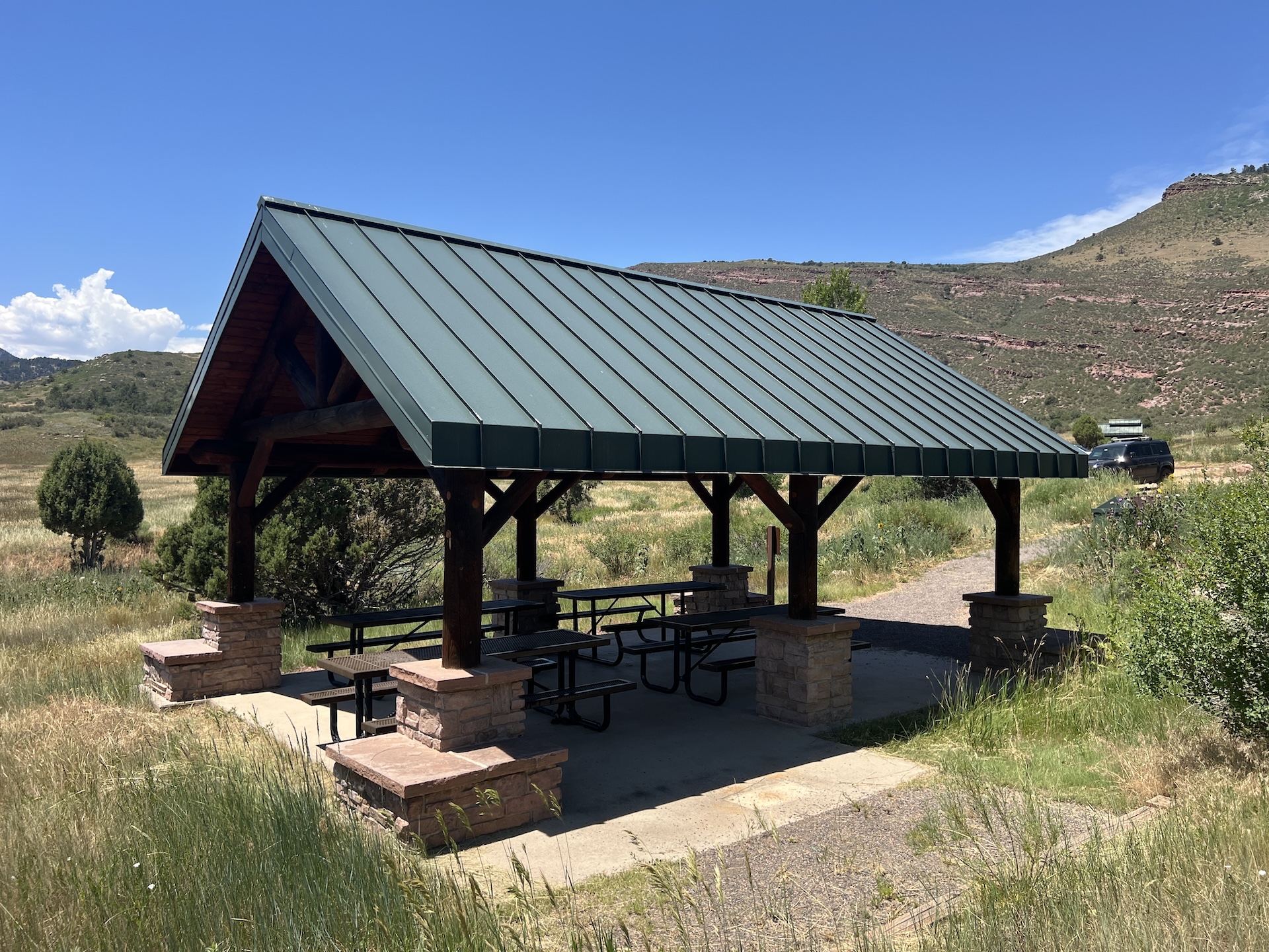 Hall Ranch shelter with four picnic tables.