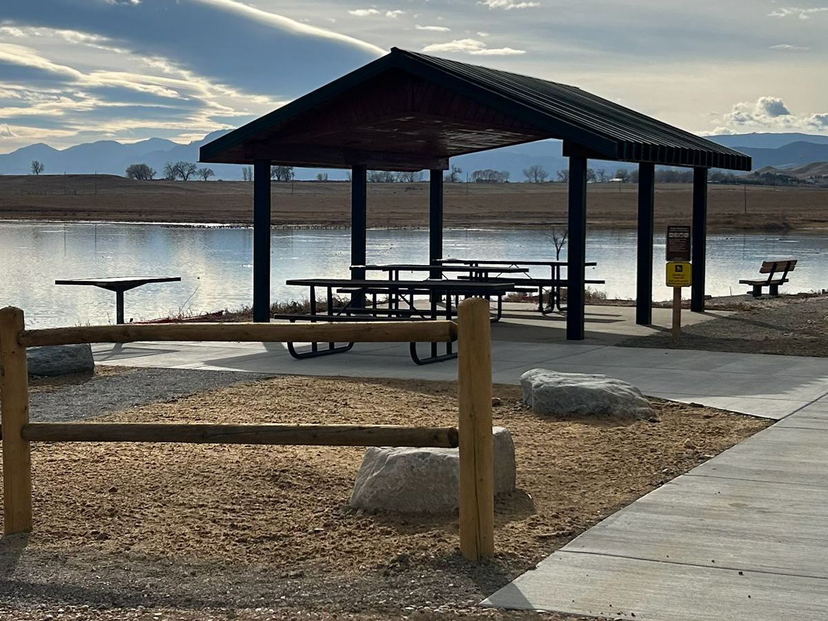 Shelter with picnic tables and a grill table at Lagerman