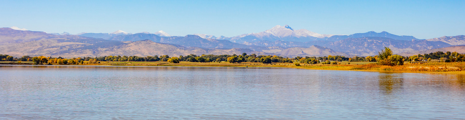 panoramic view of longs peak from mcintosh lake in longmont