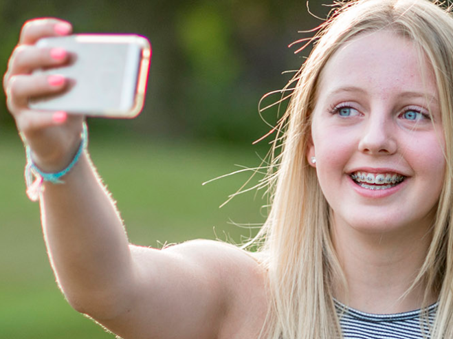 teenage girl taking a selfie