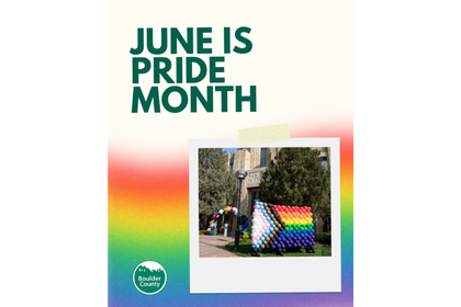 Rainbow balloon display of Pride Flag and text that says June is Pride Month