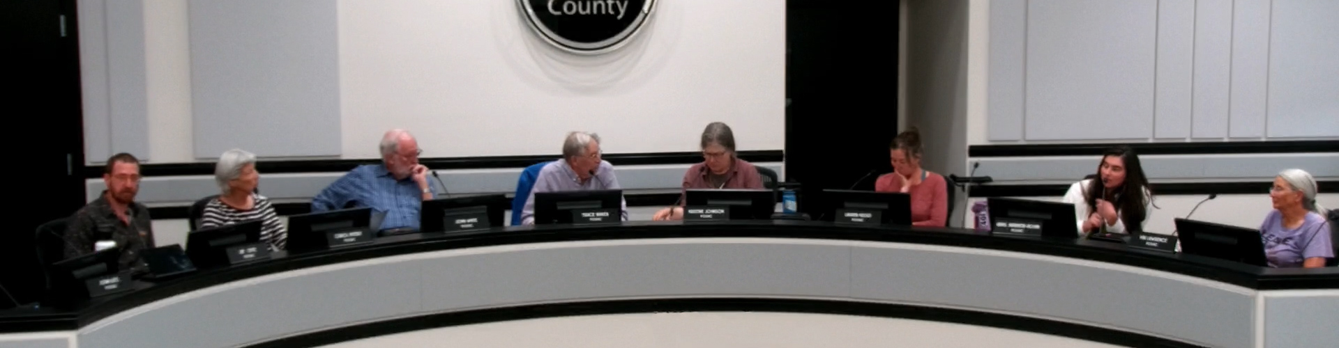 Advisory committee members sit at the dais