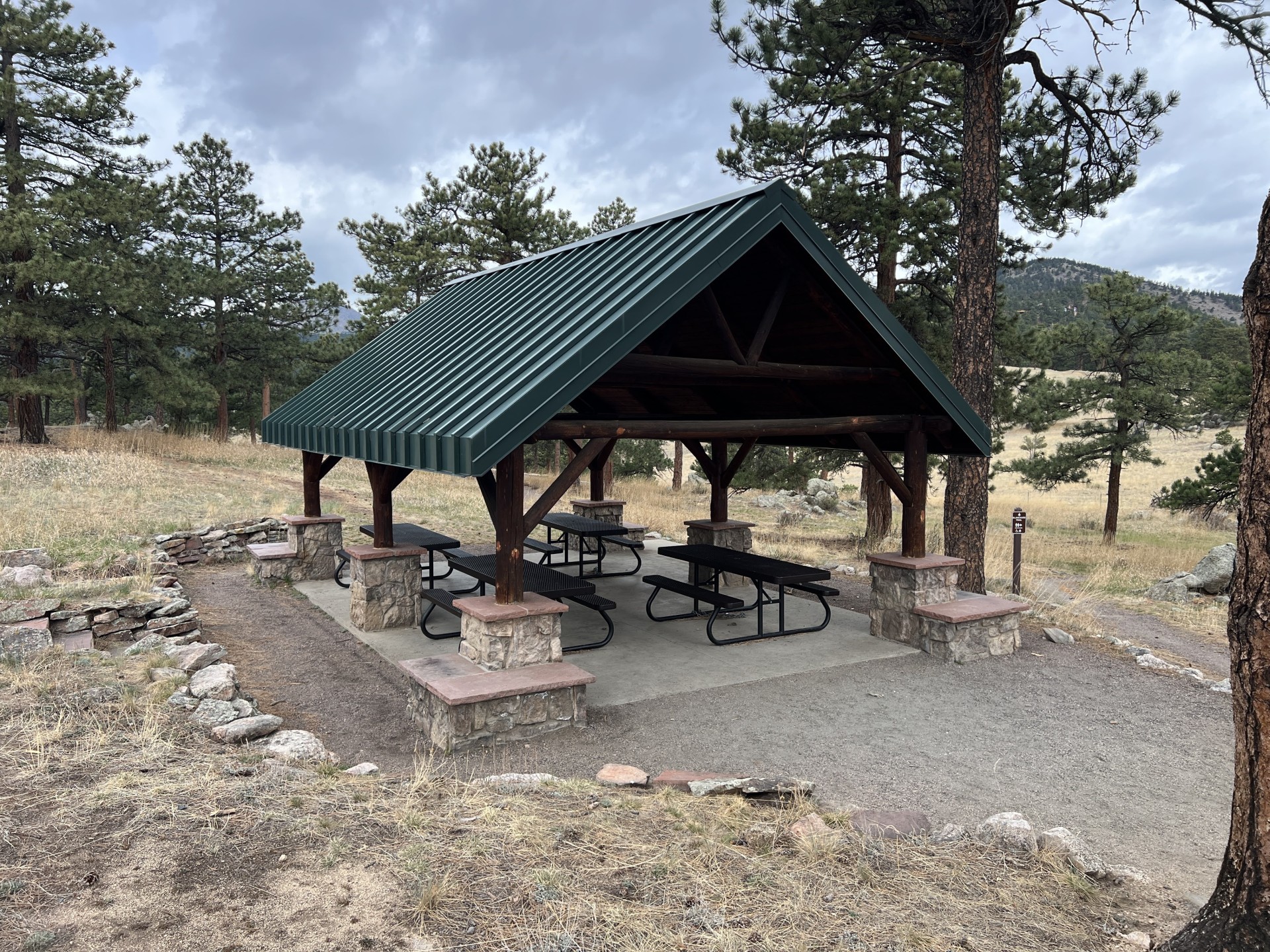 Betasso Preserve shelter with four picnic tables.