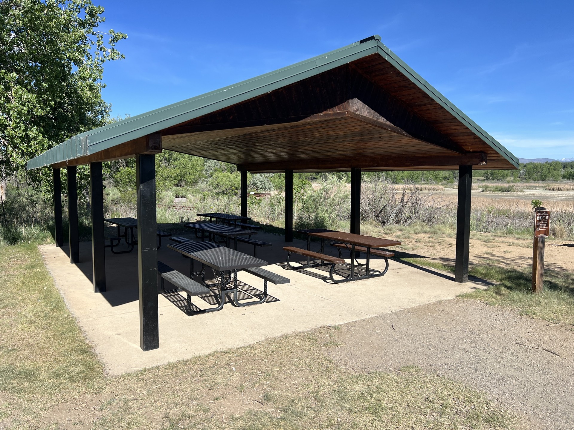 Cottonwood Marsh Shelter with five picnic tables.